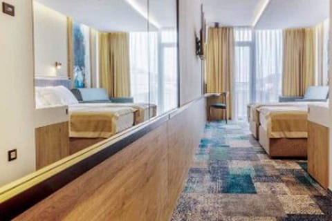 Deluxe Double or Twin Room, 1 Bedroom, Sea View | In-room safe, desk, laptop workspace, blackout drapes