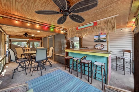 Hang out at our screened in Margaritaville Tiki Bar located under the house