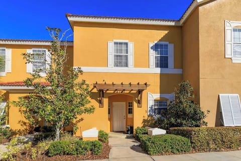 Front Entrance | Private Townhome | Lush Landscaping
Welcome to your vibrant and inviting retreat, with a warm yellow facade, charming pergola, and manicured greenery to greet you.