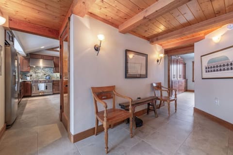 Transitional foyer / access to side patio area.