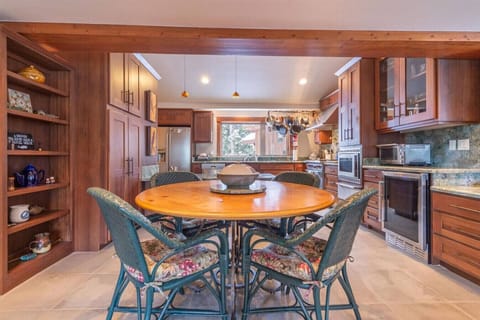 Nicely appointed kitchen with stainless appliances and additional table seating.