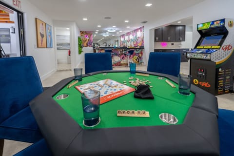 POKER TABLE & GAME ZONE! 4 Arcades games, BIG SCREEN TV, BAR, Pool table, axe throwing, basketball in & outside, bbq, fire table,swing set, board games, pool, bunk beds =best family vacay ever! 
#CardTable #PokerNight #GameNights #FamilyFLoridaAirbnb