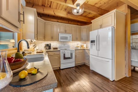Kitchen | Warm Wood Ceilings and Cream Cabinetry