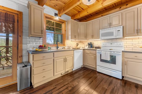 Kitchen | Warm Wood Ceilings and Cream Cabinetry