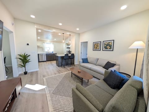 Connect with all of your guests in this open concept living area with kitchen.
