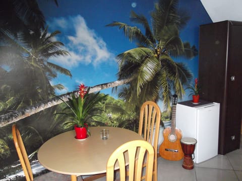 Deluxe Studio Suite, Garden View | Living area | TV