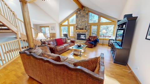 Main Floor Living Area with Flatscreen, Gas Fireplace, Large Win - Main Floor Living Area with Flatscreen, Gas Fireplace, Large Windows