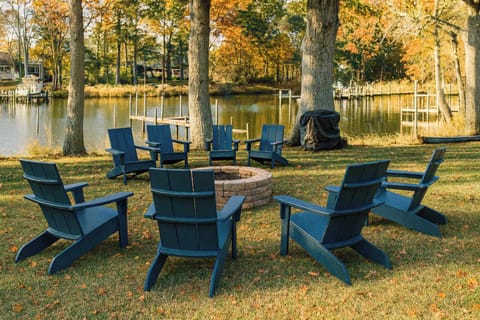 Gather around the firepit overlooking Cabin Point Creek. Cozy seating, glowing logs, and peaceful views make evenings unforgettable.