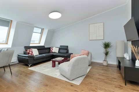 Bright living area with comfortable sofa and dining corner.