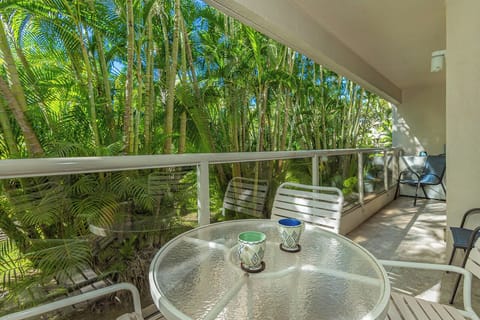 Relax on your private lanai with peaceful garden views
