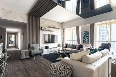 Deluxe Penthouse, 4 Bedrooms, City View | Living area | 45-inch Smart TV with digital channels, Netflix, streaming services
