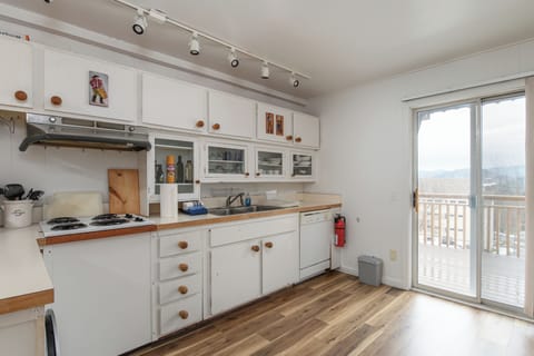 Your bright and sunny kitchen awaits with warm wood countertops and some of the essentials to create simple meals. Step outside to your private balcony and soak in the breathtaking views while your morning coffee brews.