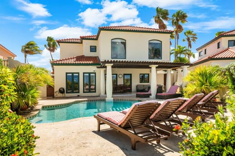 the Villa and it’s inviting pool area, harmoniously integrated into the lush natural surroundings