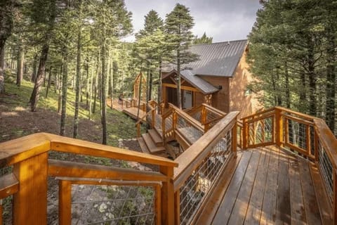 Wind up the wooden walkway through the pines to your door
