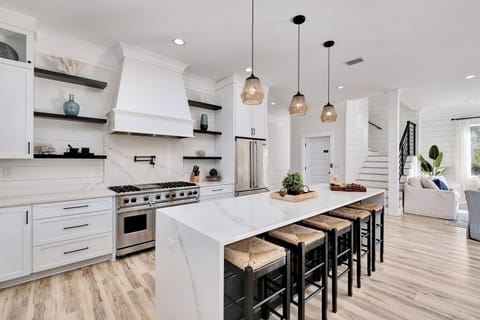 2nd Floor - Chef’s dream kitchen with Viking appliances, marble waterfall island, gas range, and seating for the whole group. Ideal for cooking, entertaining, and hosting unforgettable family meals.