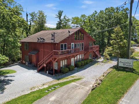 Charming cabin exterior with private entrance, wooded setting, and peaceful mountain surroundings.