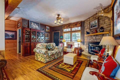 Inviting space with warm lighting, rustic decor, and charming views, perfect for relaxation!