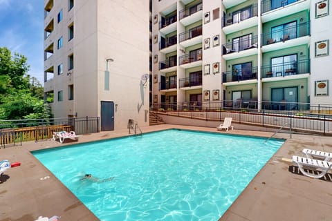 Poolside paradise: awaits. And, dive into relaxation in this refreshing pool surrounded by lush greenery!