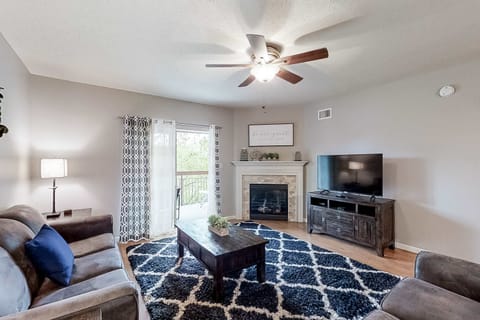 Relax in style with a fireplace, plush seating, and scenic balcony views!