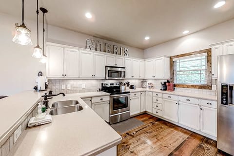 Whip up culinary delights in this well-equipped kitchen with rustic charm!