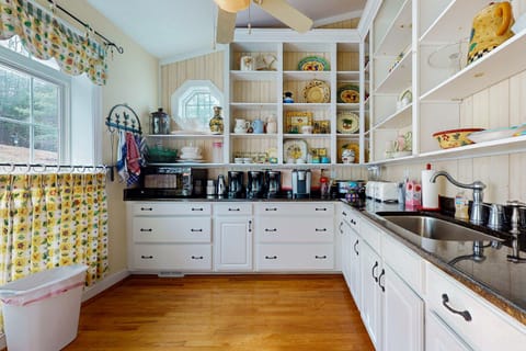 Whip up delights in this sunny space with stylish dishes and modern appliances!