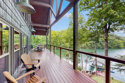 Relax on the covered lakefront deck with comfortable seating and uninterrupted water views. Perfect for morning coffee, alfresco dining.