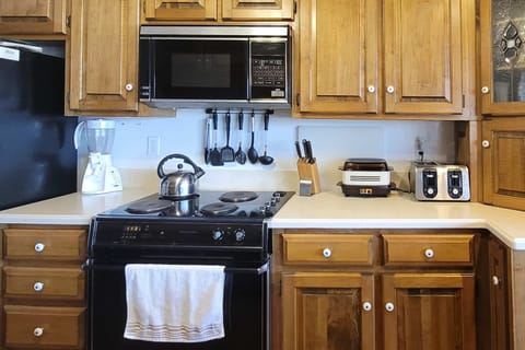 A chef's delight with modern appliances and warm wood finishes, perfect for culinary adventures!