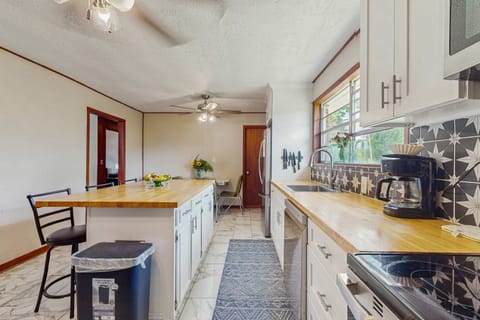 Bright & Functional Kitchen awaits. And, enjoy meal prep at the spacious island with charming views and modern decor!