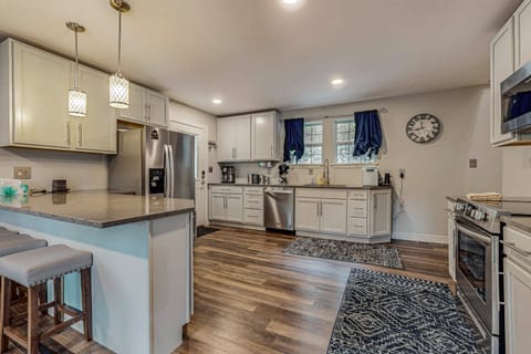 Beautiful modern kitchen with updated cabinets, full-size appliances, and plenty of counter space. Ideal for cooking, entertaining, and enjoying a comfortable lake cabin getaway.