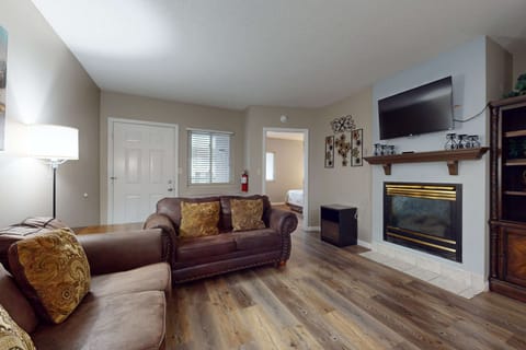 Inviting space with elegant decor, a warm fireplace, and plush seating for gatherings!