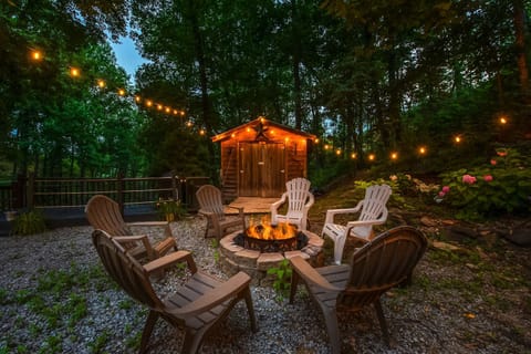 Outdoor Fire Pit Retreat awaits! Gather around the flickering flames under twinkling lights!