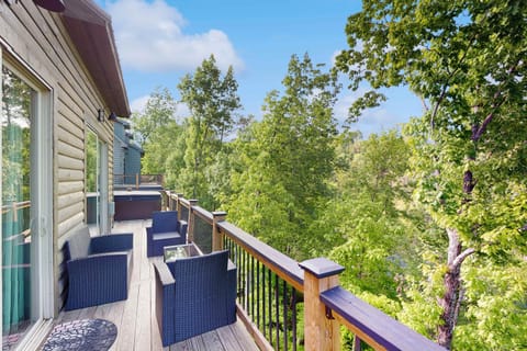 Unwind on this spacious deck with stunning forest views and chic seating!