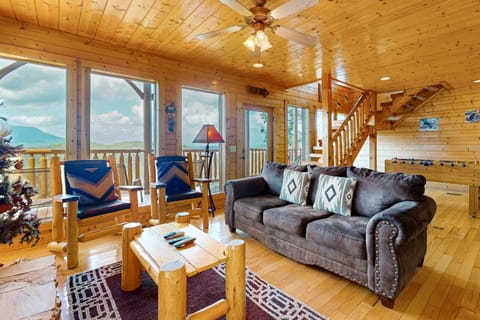 Panoramic Smoky Mountain views from the covered deck at A Walk in the Clouds, a cabin at Black Bear Ridge Resort in Pigeon Forge, Tennessee.