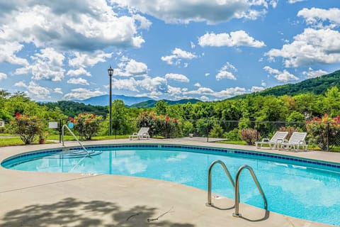 Seasonal outdoor pool with loungers and stunning mountain views. Resort-style amenities make this condo perfect for summer vacations, couples, and family getaways.