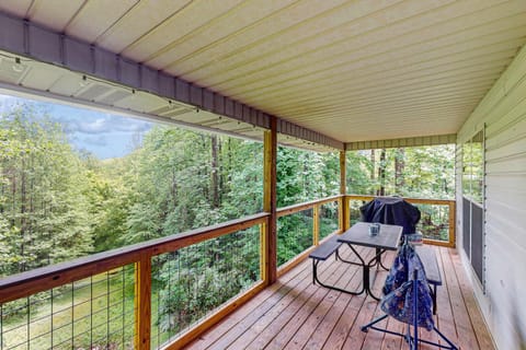 Savor forest views while dining al fresco on this charming, secluded porch!