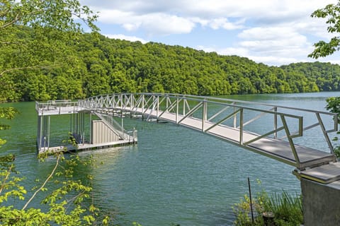 Private covered dock with easy lake access. Perfect for boating, swimming, fishing, and enjoying peaceful mornings on the water in East Tennessee.