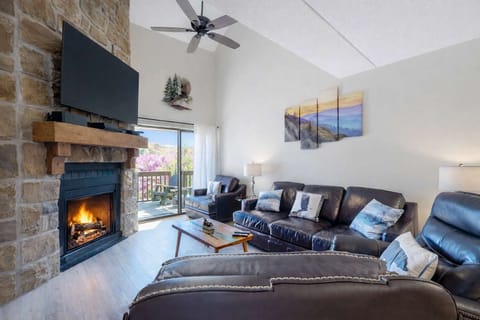 Experience mountain views and warmth by the fire in this stylish gathering space!