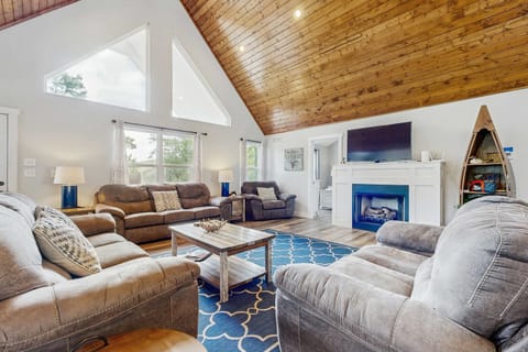 Sunlit sanctuary with vaulted ceilings and inviting seating for memorable gatherings!