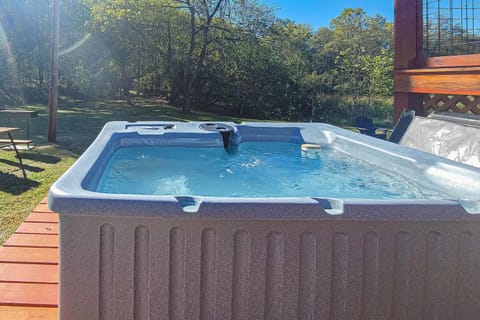 Hot tub haven awaits. And, unwind under the sun in your own relaxing retreat, surrounded by nature's beauty!