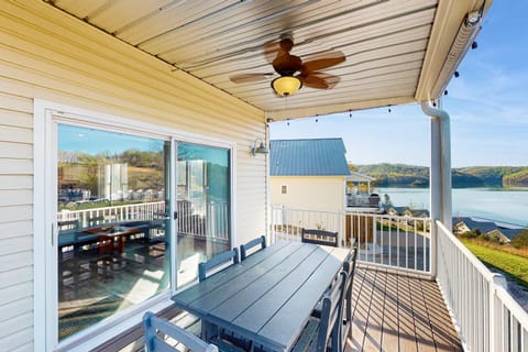 Enjoy stunning lake views from this spacious deck with stylish seating!