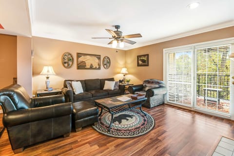 Relax in this inviting space with rustic decor and vibrant views from large windows!