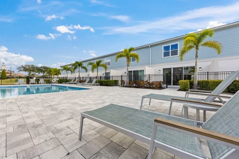 Relaxing view of the community pool from your sunbathing bench—soak up the sun, unwind in style, and enjoy the resort-like atmosphere.