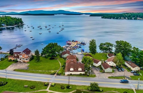 Stunning aerial views of Lake Winnipesaukee—just steps from the water, marinas, and community beach.