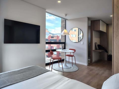 Relax by watching TV in bed