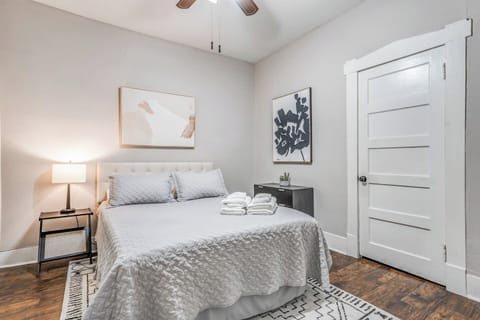 Settle into a peaceful bedroom with soft lighting and cozy bedding for restful, uninterrupted sleep.