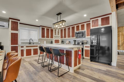 The kitchen island seats 3!