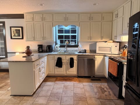 Full kitchen stocked with basic essentials for your stay.
