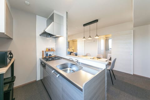 Superior Suite, Non Smoking, City View | Private kitchen | Full-size fridge, microwave, electric kettle, cookware/dishes/utensils
