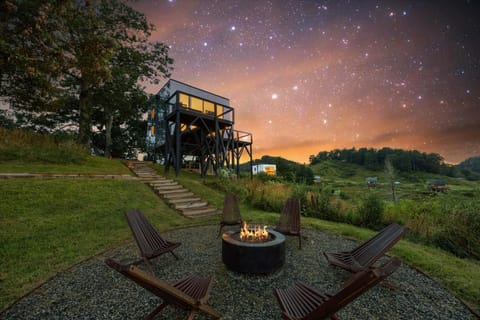 The firepit area is arranged for guest use and comfort.