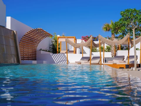Outdoor pool, open 11:00 AM to 8:00 PM, pool umbrellas, sun loungers